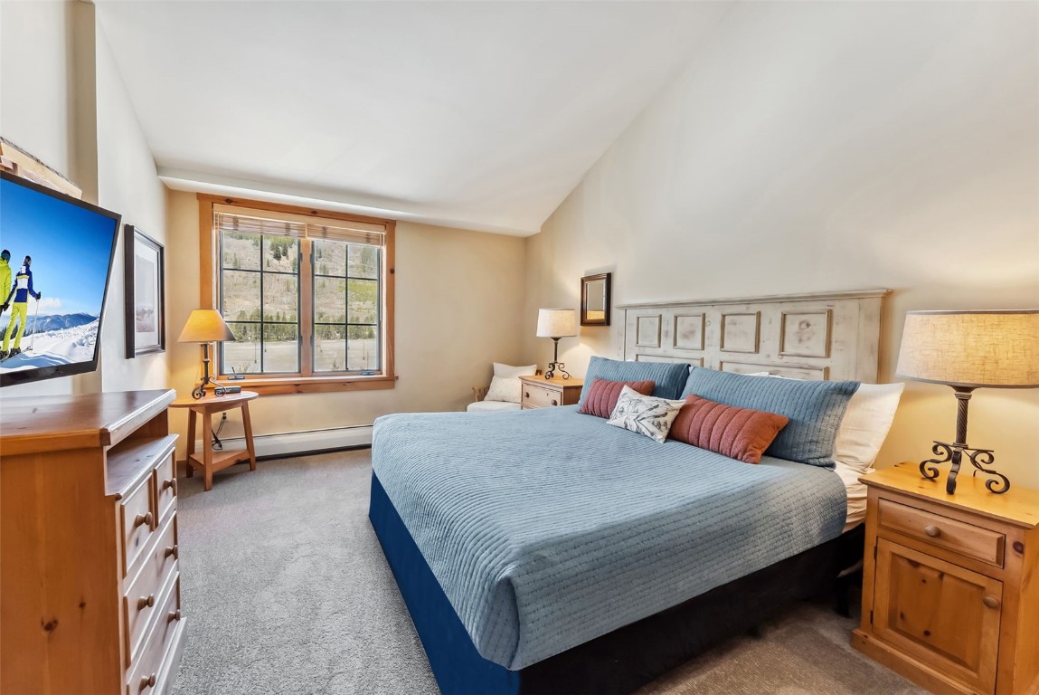 150 Dercum Square, Unit 8530 Keystone, CO 80435 - Photo 14 of 35 a bedroom with a bed a dresser and a window