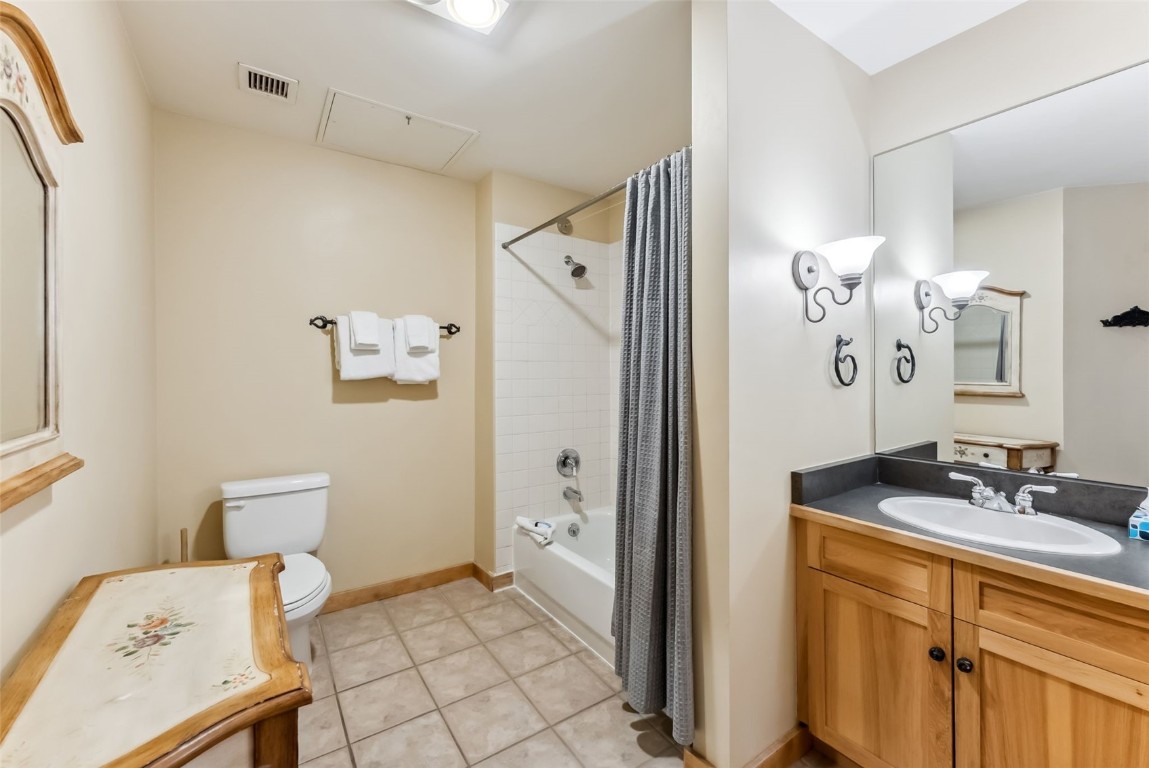 150 Dercum Square, Unit 8530 Keystone, CO 80435 - Photo 15 of 35 a bathroom with a sink mirror and a toilet