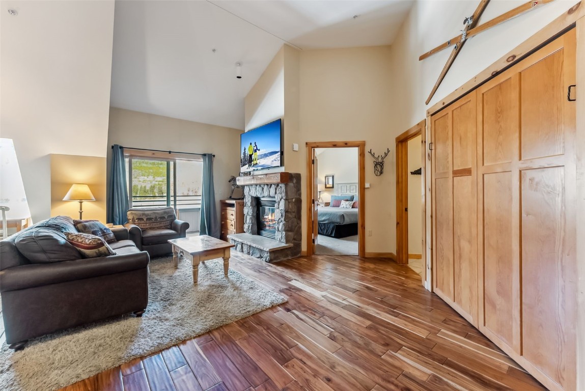 150 Dercum Square, Unit 8530 Keystone, CO 80435 - Photo 3 of 35 a living room with furniture and a fireplace