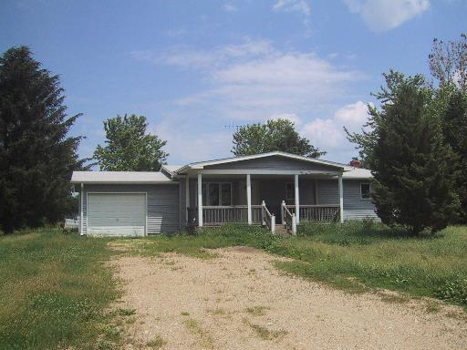 10069 South Mayfield Road Sycamore, IL 60178 - Photo 1 of 1 a front view of a house with garden