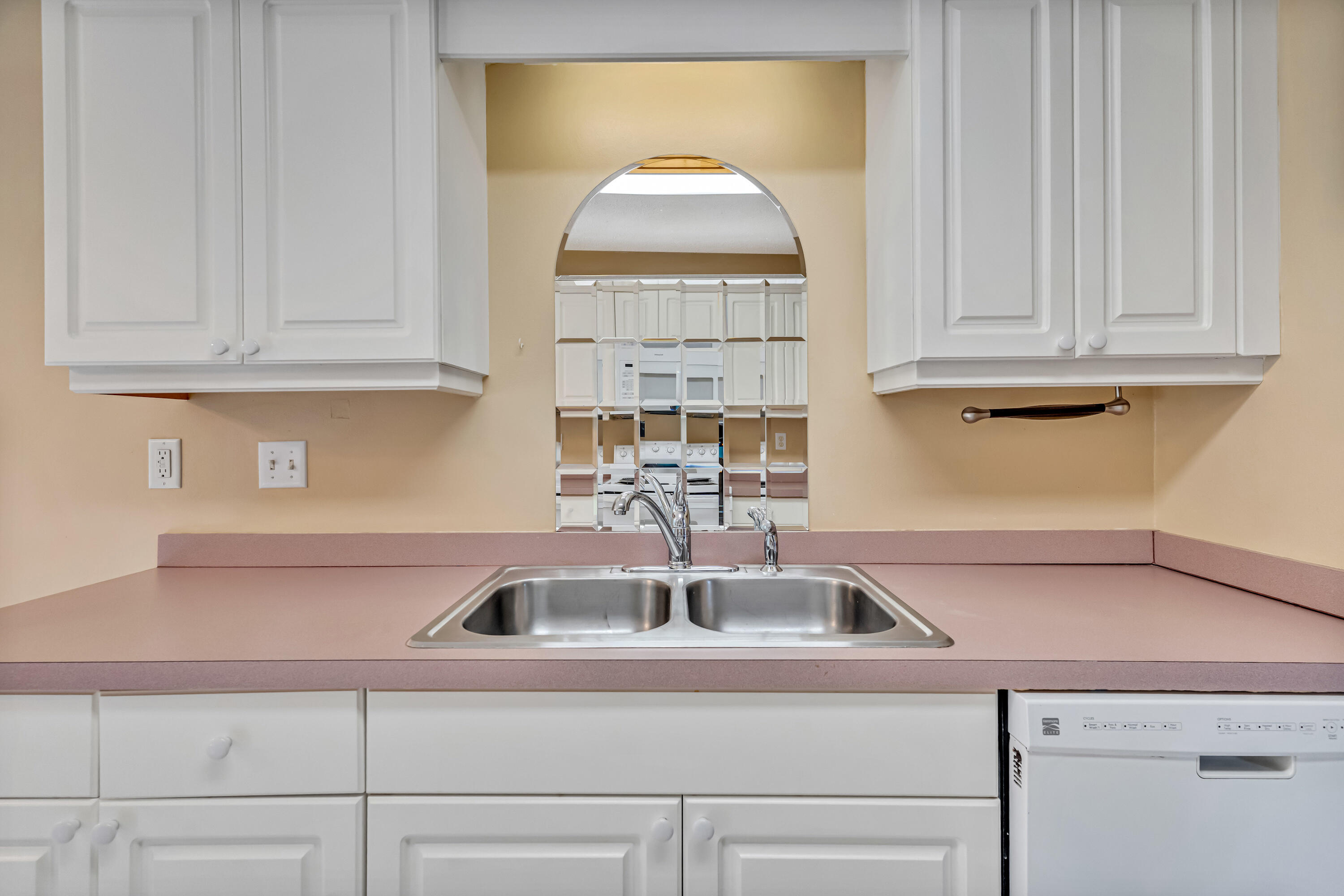 1249 Jefferyscot Drive Crestview, FL 32536 - Photo 14 of 40 a kitchen with a sink cabinets and a window