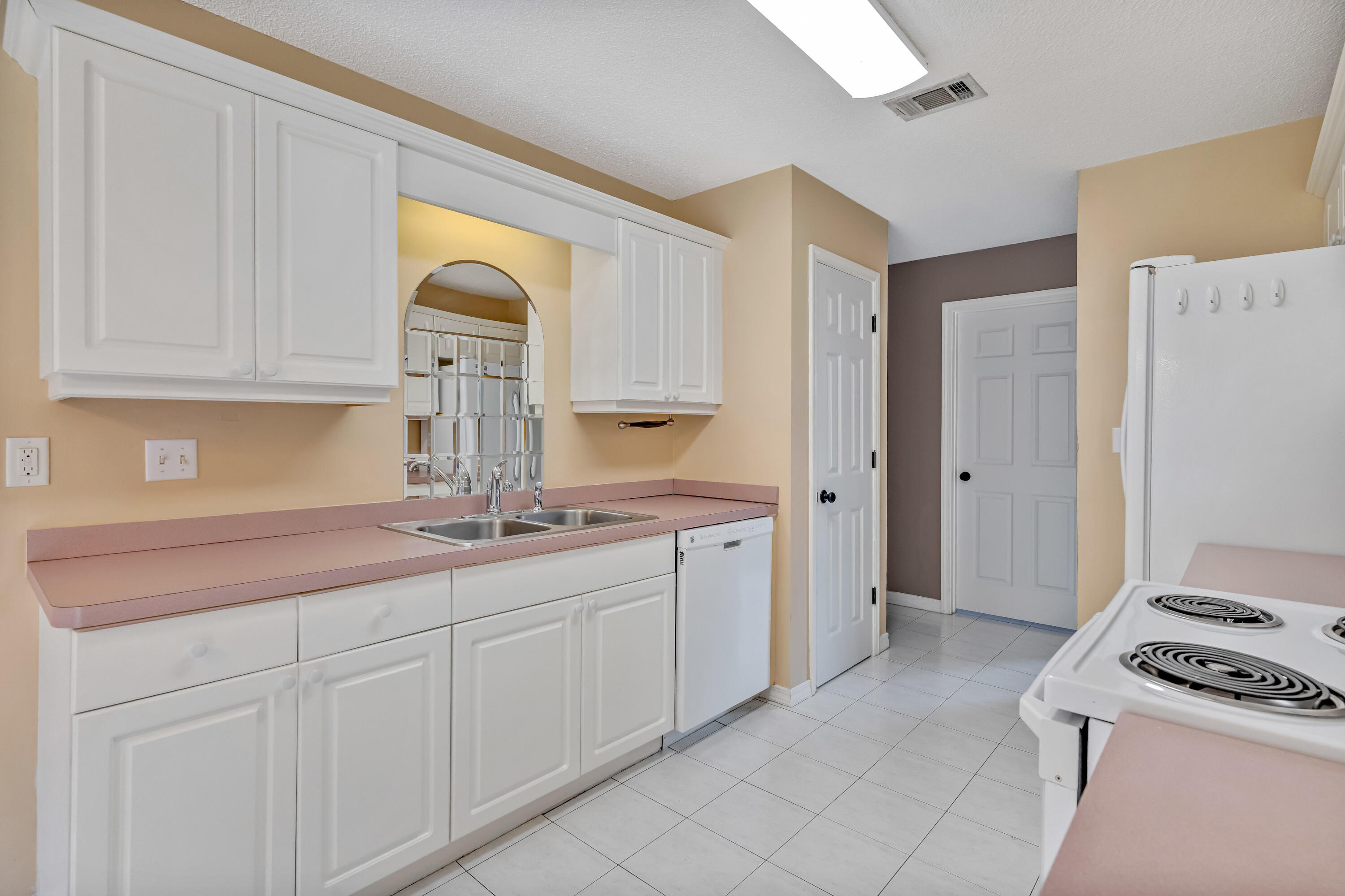 1249 Jefferyscot Drive Crestview, FL 32536 - Photo 16 of 40 a kitchen with stainless steel appliances granite countertop a sink and a stove