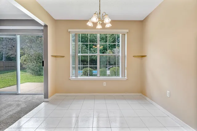 a view of an empty room with glass door