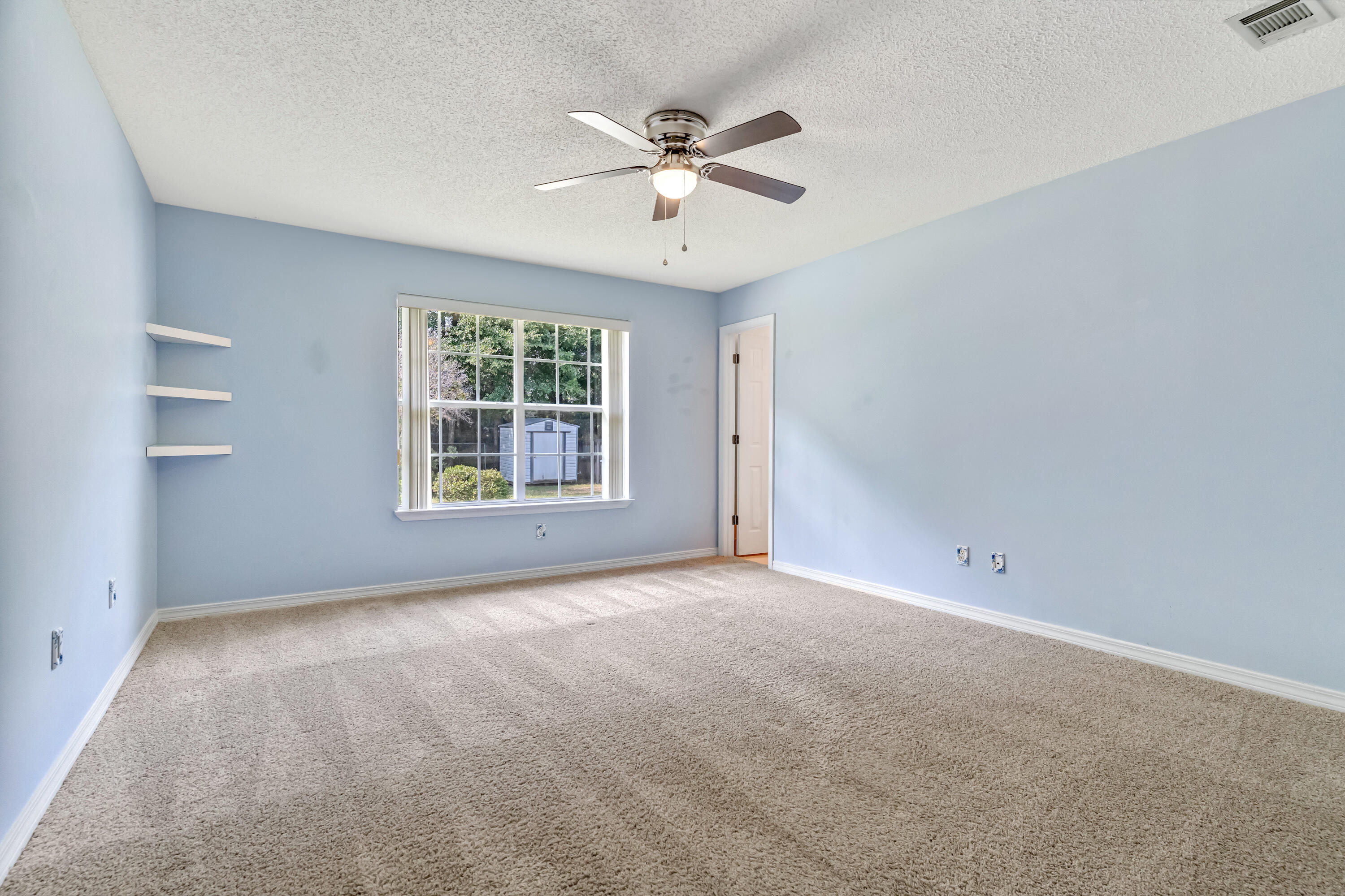 1249 Jefferyscot Drive Crestview, FL 32536 - Photo 19 of 40 a view of an empty room with a window