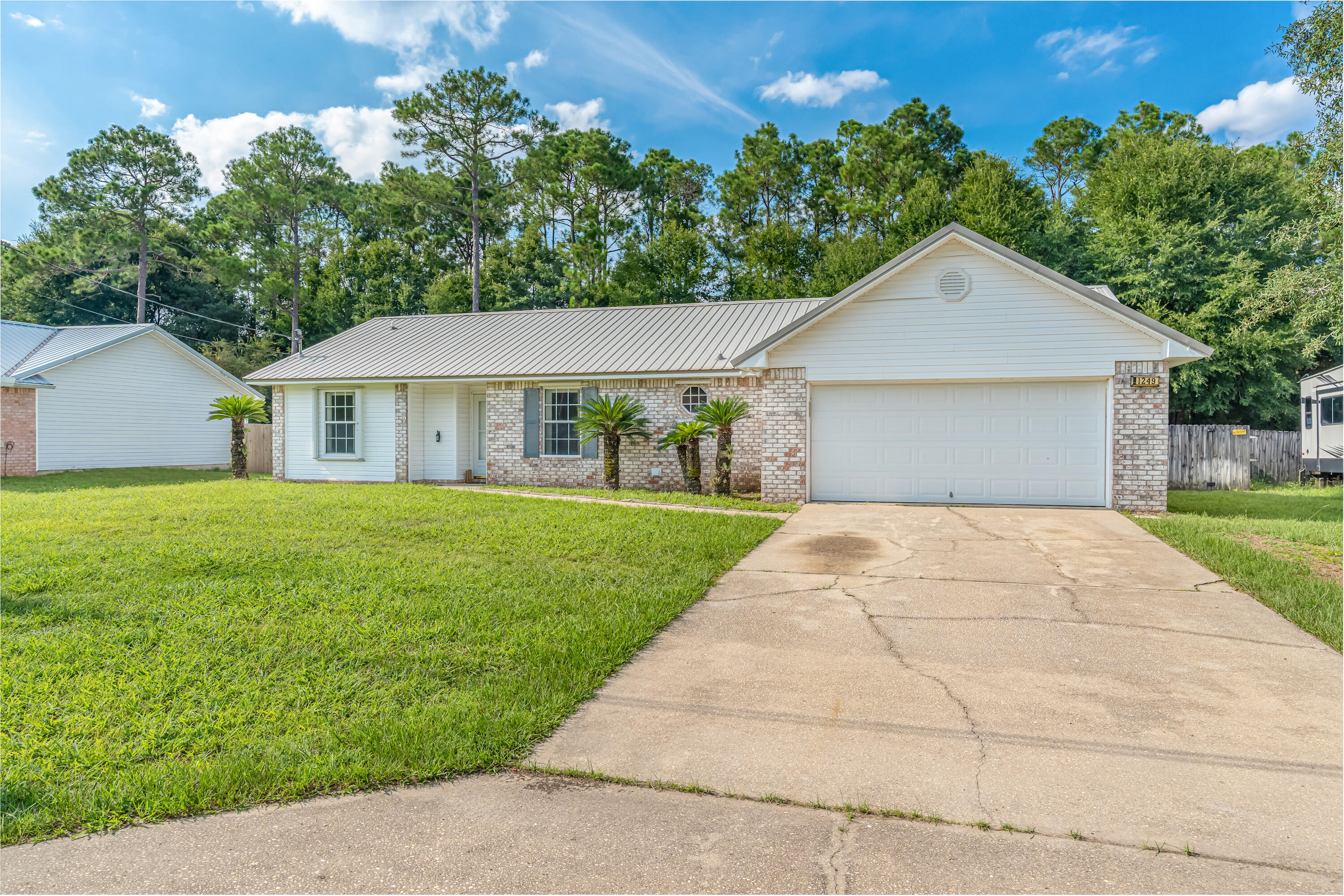 1249 Jefferyscot Drive Crestview, FL 32536 - Photo 2 of 40 a front view of house with yard and green space