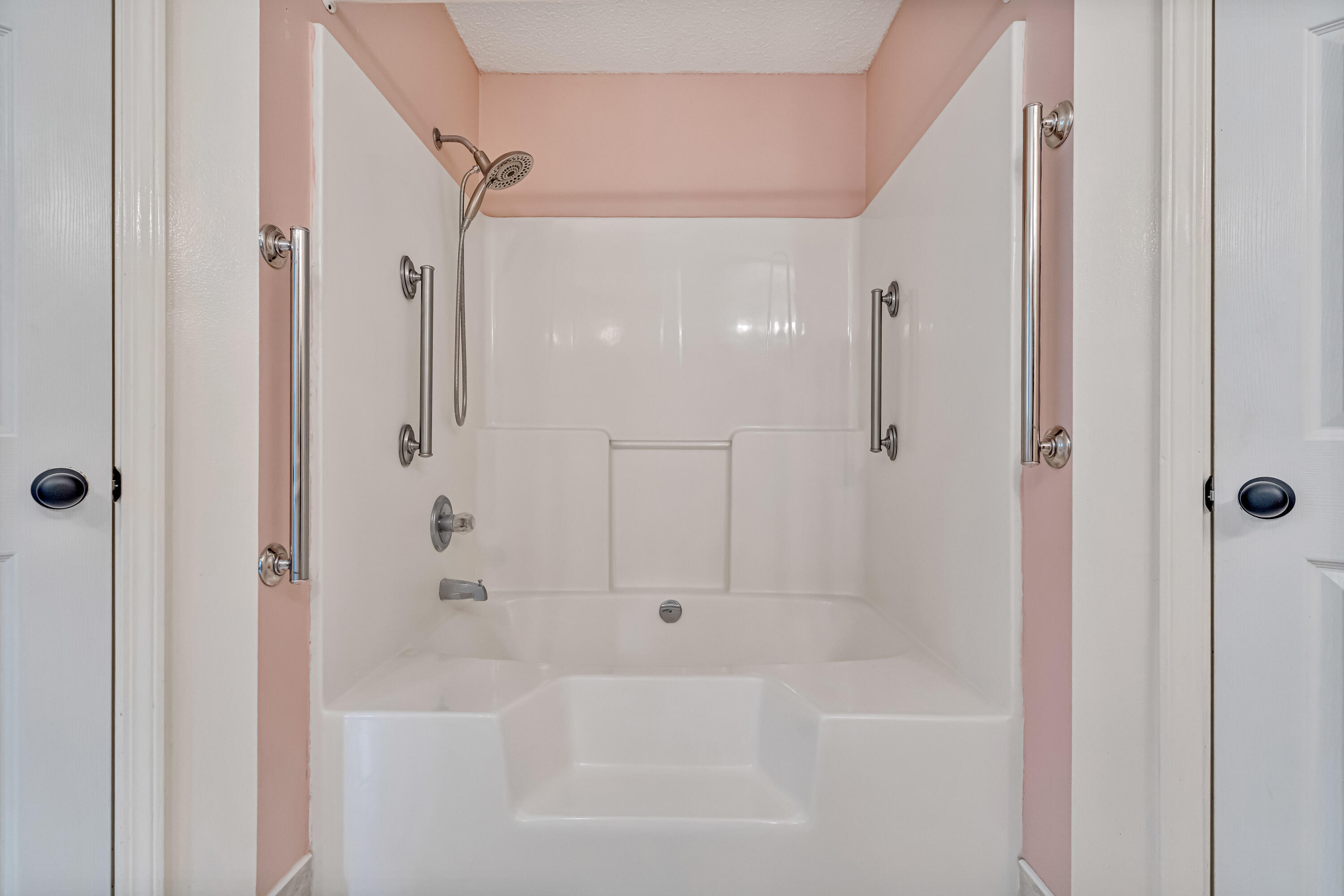 1249 Jefferyscot Drive Crestview, FL 32536 - Photo 23 of 40 a bathroom with a bathtub and a shower