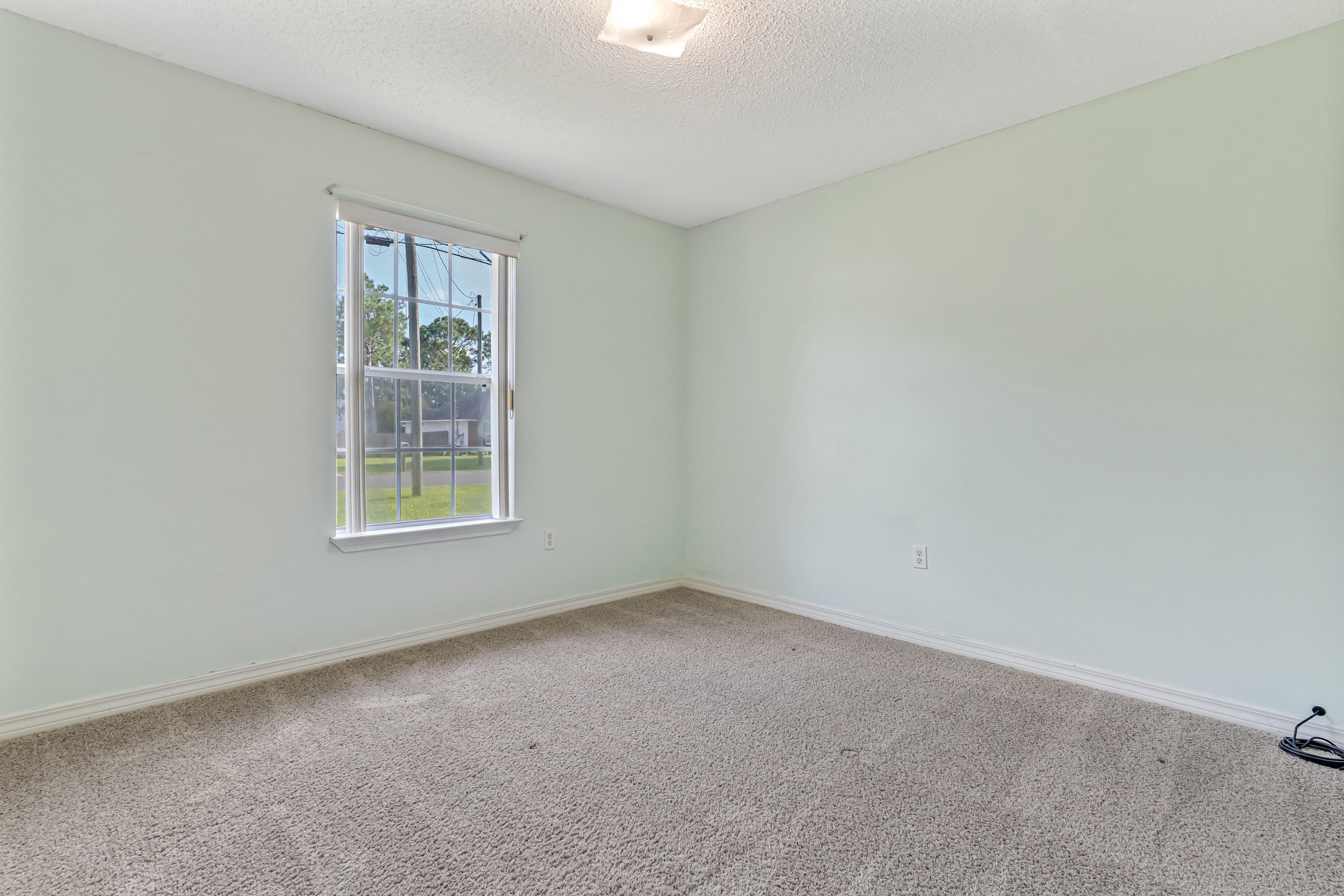 1249 Jefferyscot Drive Crestview, FL 32536 - Photo 27 of 40 an empty room with windows