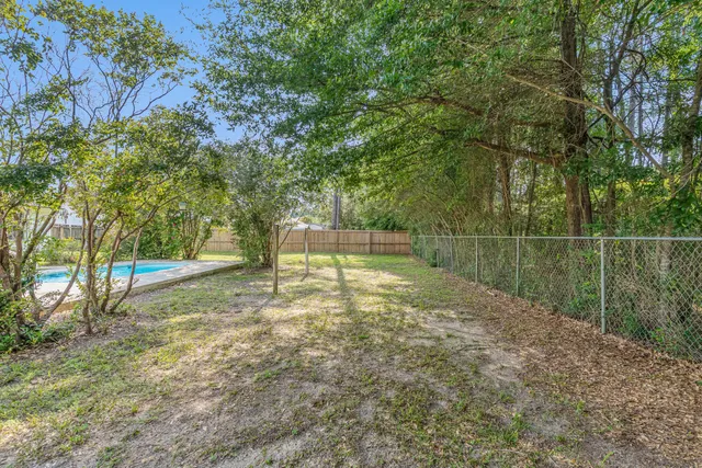 a view of backyard with green space