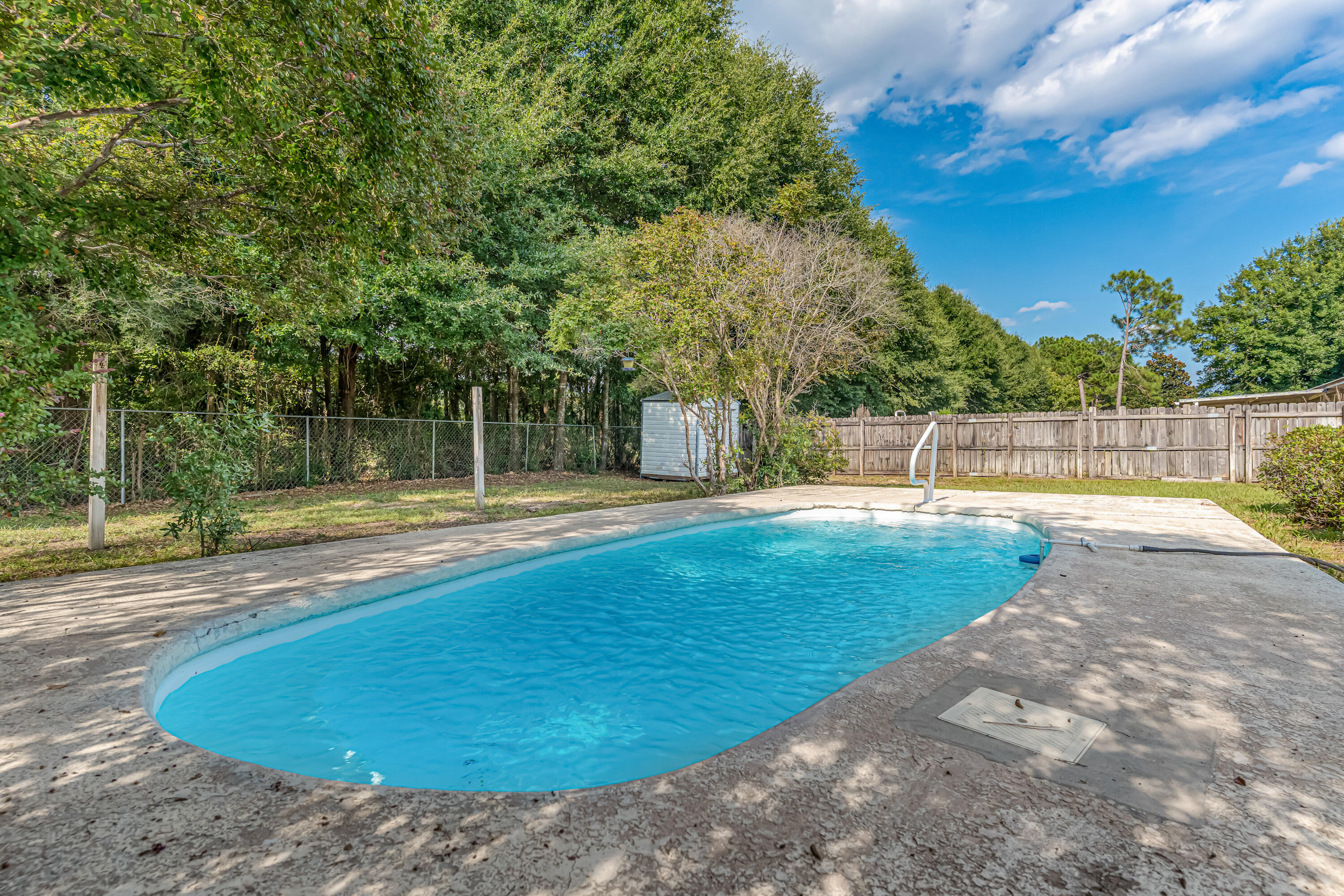 1249 Jefferyscot Drive Crestview, FL 32536 - Photo 5 of 40 a view of a swimming pool with a yard