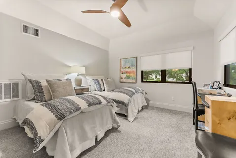 a bed room with bed and window