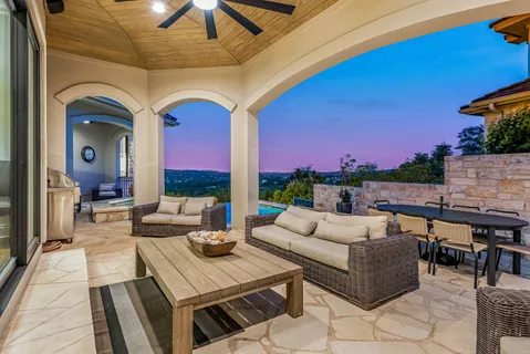 a outdoor space with patio couches and a potted plant