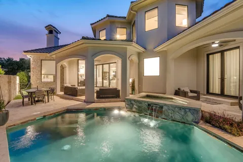 a view of a house with swimming pool