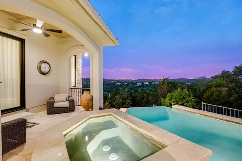 a view of a swimming pool with a lounge chair