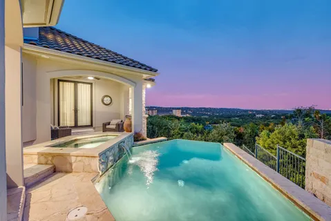 a view of a swimming pool with a balcony