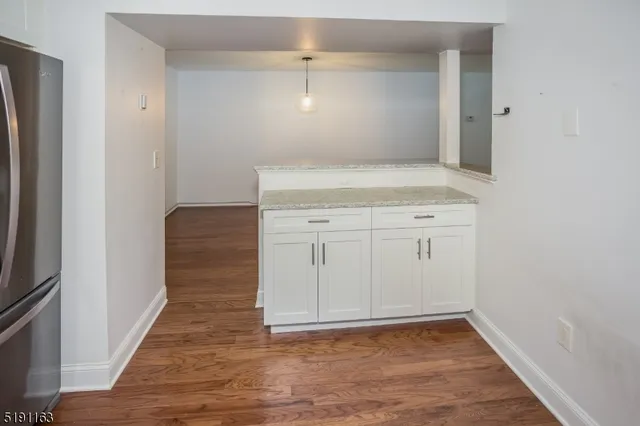 a kitchen with stainless steel appliances granite countertop a stove top oven a sink and a granite counter tops