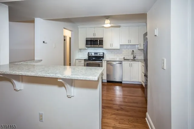 a view of a hallway with a bedroom