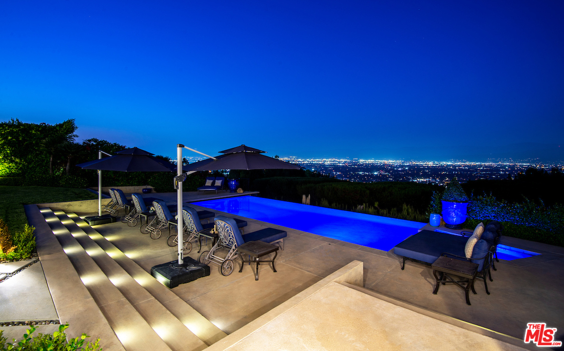 3316 Clerendon Road Beverly Hills, CA 91423 - Photo 1 of 53 a view of swimming pool with seating area and barbeque oven