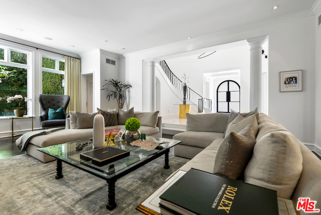 3316 Clerendon Road Beverly Hills, CA 91423 - Photo 11 of 53 a living room with furniture and a potted plant