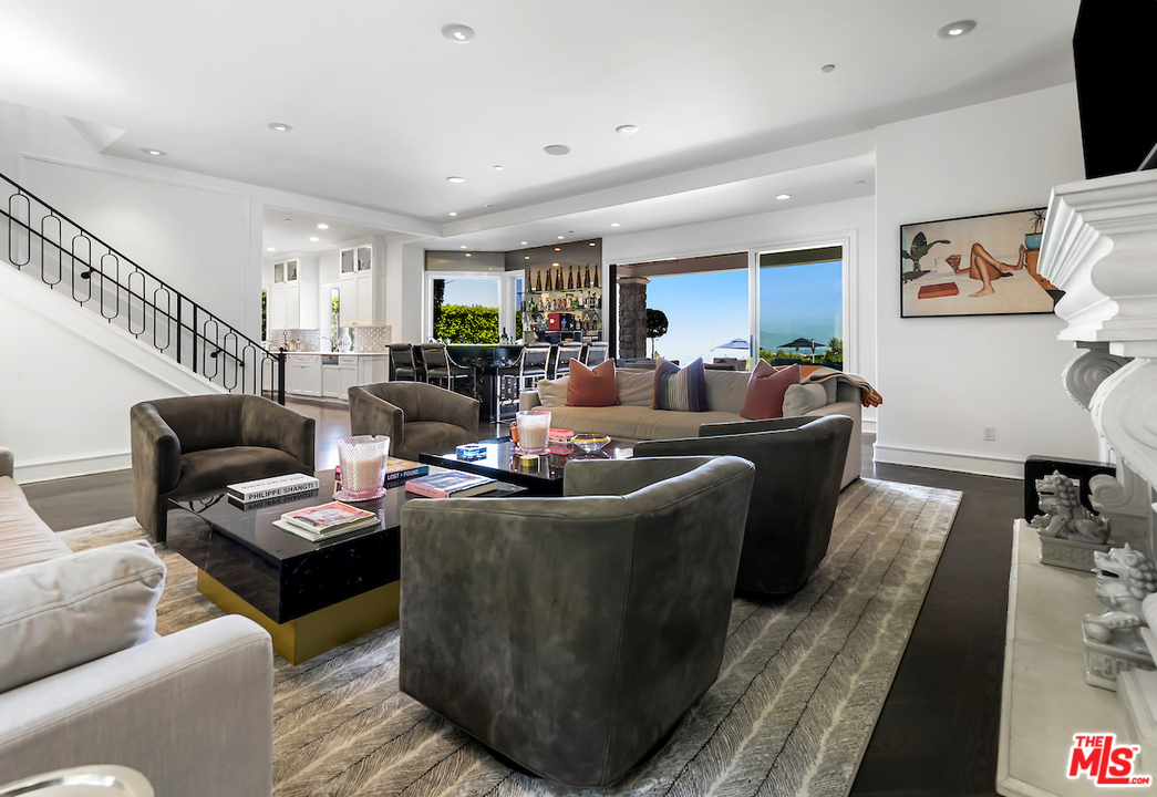 3316 Clerendon Road Beverly Hills, CA 91423 - Photo 14 of 53 a living room with furniture and a flat screen tv