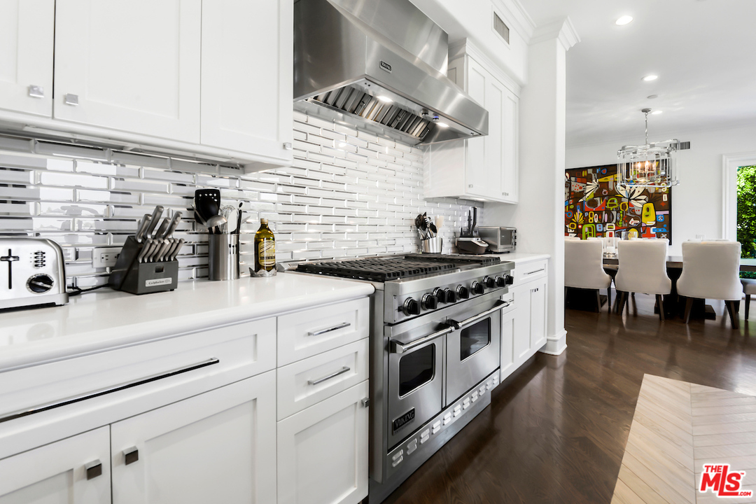 3316 Clerendon Road Beverly Hills, CA 91423 - Photo 19 of 53 a kitchen with a stove and cabinets