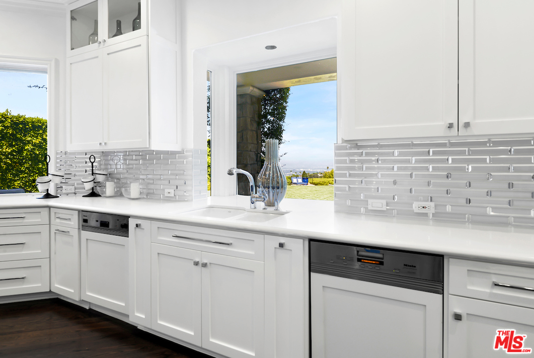 3316 Clerendon Road Beverly Hills, CA 91423 - Photo 20 of 53 a sink with white cabinets and a sink