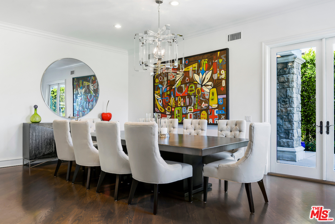 3316 Clerendon Road Beverly Hills, CA 91423 - Photo 21 of 53 a view of a dining room with furniture window and wooden floor
