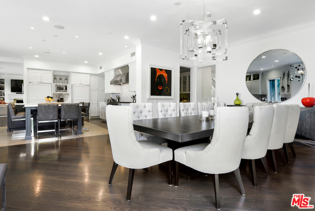 3316 Clerendon Road Beverly Hills, CA 91423 - Photo 22 of 53 a view of a dining room with furniture and wooden floor