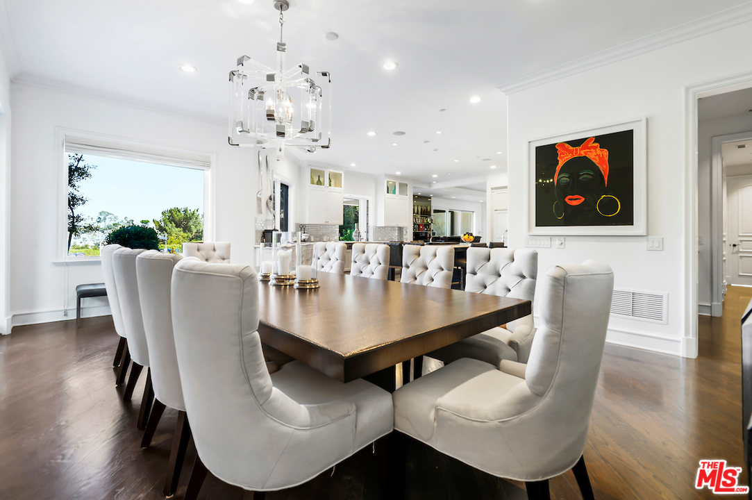 3316 Clerendon Road Beverly Hills, CA 91423 - Photo 23 of 53 a view of a dining room with furniture and wooden floor