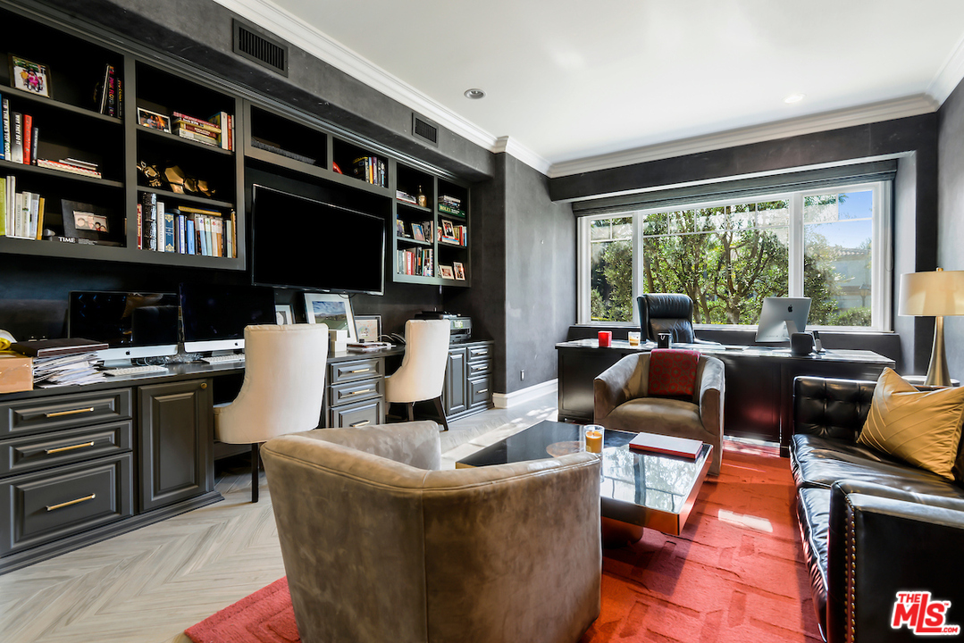 3316 Clerendon Road Beverly Hills, CA 91423 - Photo 25 of 53 a living room with furniture and a fireplace