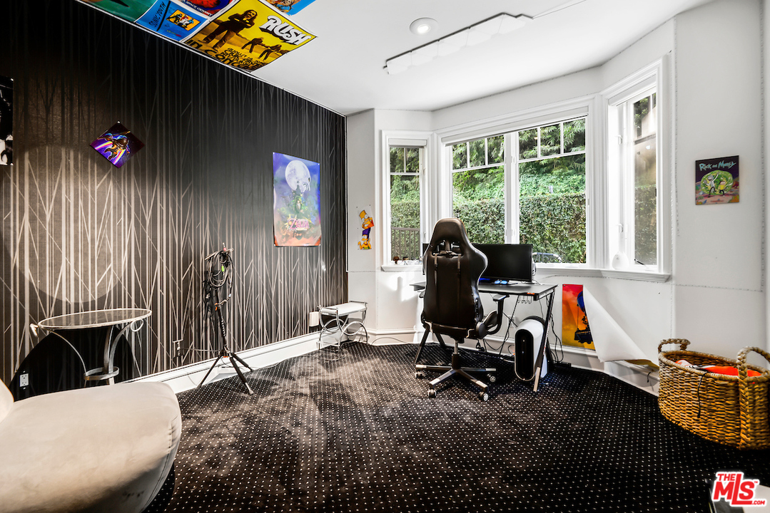 3316 Clerendon Road Beverly Hills, CA 91423 - Photo 26 of 53 a living room with furniture a flat screen tv and a large window