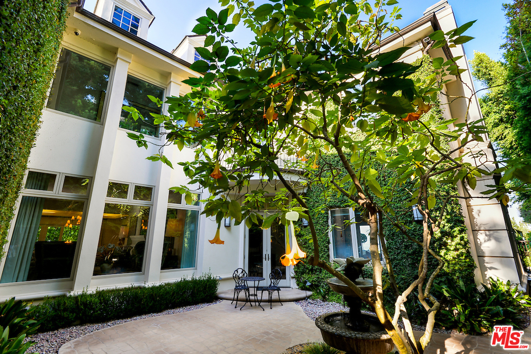3316 Clerendon Road Beverly Hills, CA 91423 - Photo 28 of 53 a front view of a house with a tree