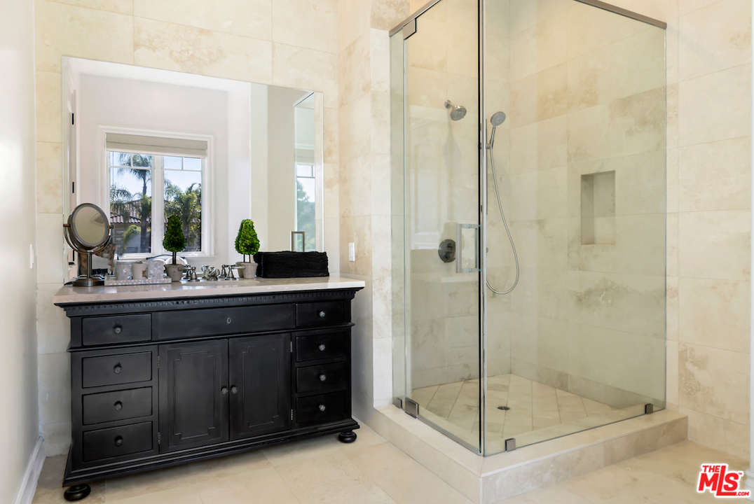 3316 Clerendon Road Beverly Hills, CA 91423 - Photo 34 of 53 a bathroom with a shower sink and mirror