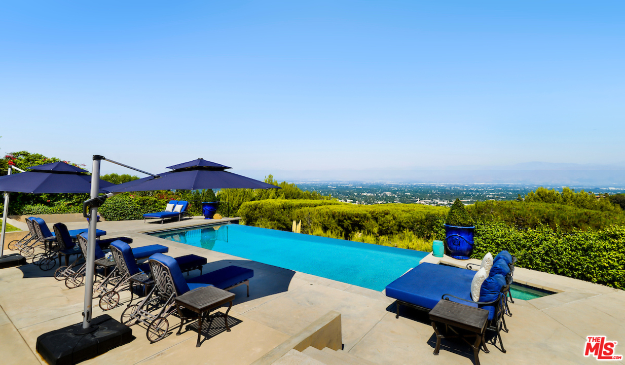 3316 Clerendon Road Beverly Hills, CA 91423 - Photo 5 of 53 an outdoor sitting area with furniture and garden view