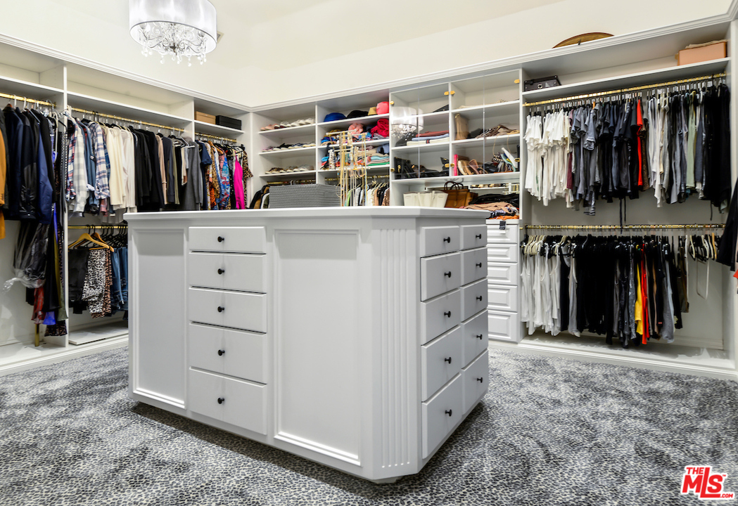 3316 Clerendon Road Beverly Hills, CA 91423 - Photo 42 of 53 a view of walk in closet with clothes and shoes