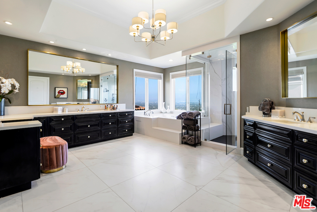 3316 Clerendon Road Beverly Hills, CA 91423 - Photo 43 of 53 a spacious bathroom with a double vanity sink double and a mirror