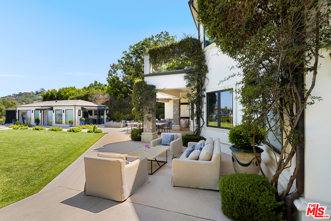 3316 Clerendon Road Beverly Hills, CA 91423 - Photo 45 of 53 a view of a house with backyard sitting area and garden