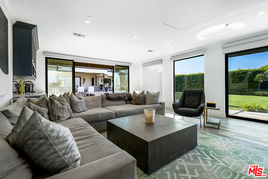3316 Clerendon Road Beverly Hills, CA 91423 - Photo 50 of 53 a living room with furniture and a flat screen tv