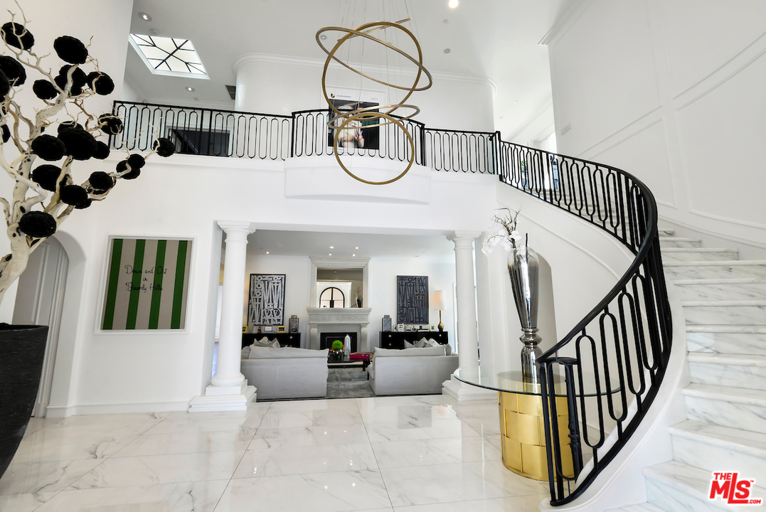 3316 Clerendon Road Beverly Hills, CA 91423 - Photo 8 of 53 a view of staircase with a rug