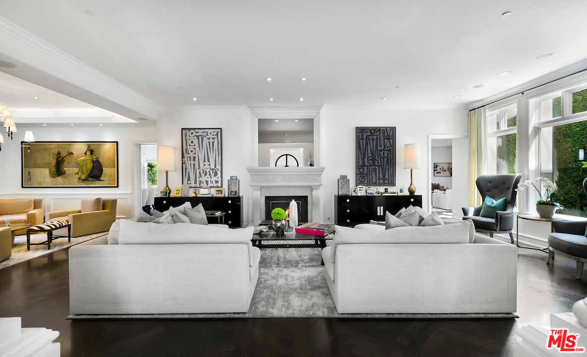 3316 Clerendon Road Beverly Hills, CA 91423 - Photo 9 of 53 a living room with fireplace furniture and a large window