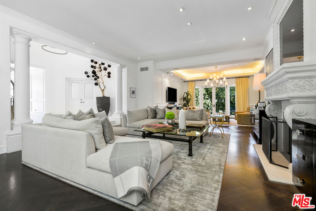 3316 Clerendon Road Beverly Hills, CA 91423 - Photo 10 of 53 a living room with fireplace furniture and a large window