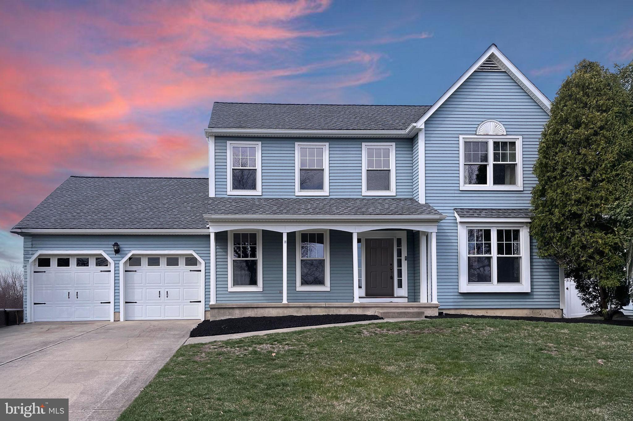 front view of a house with a garden