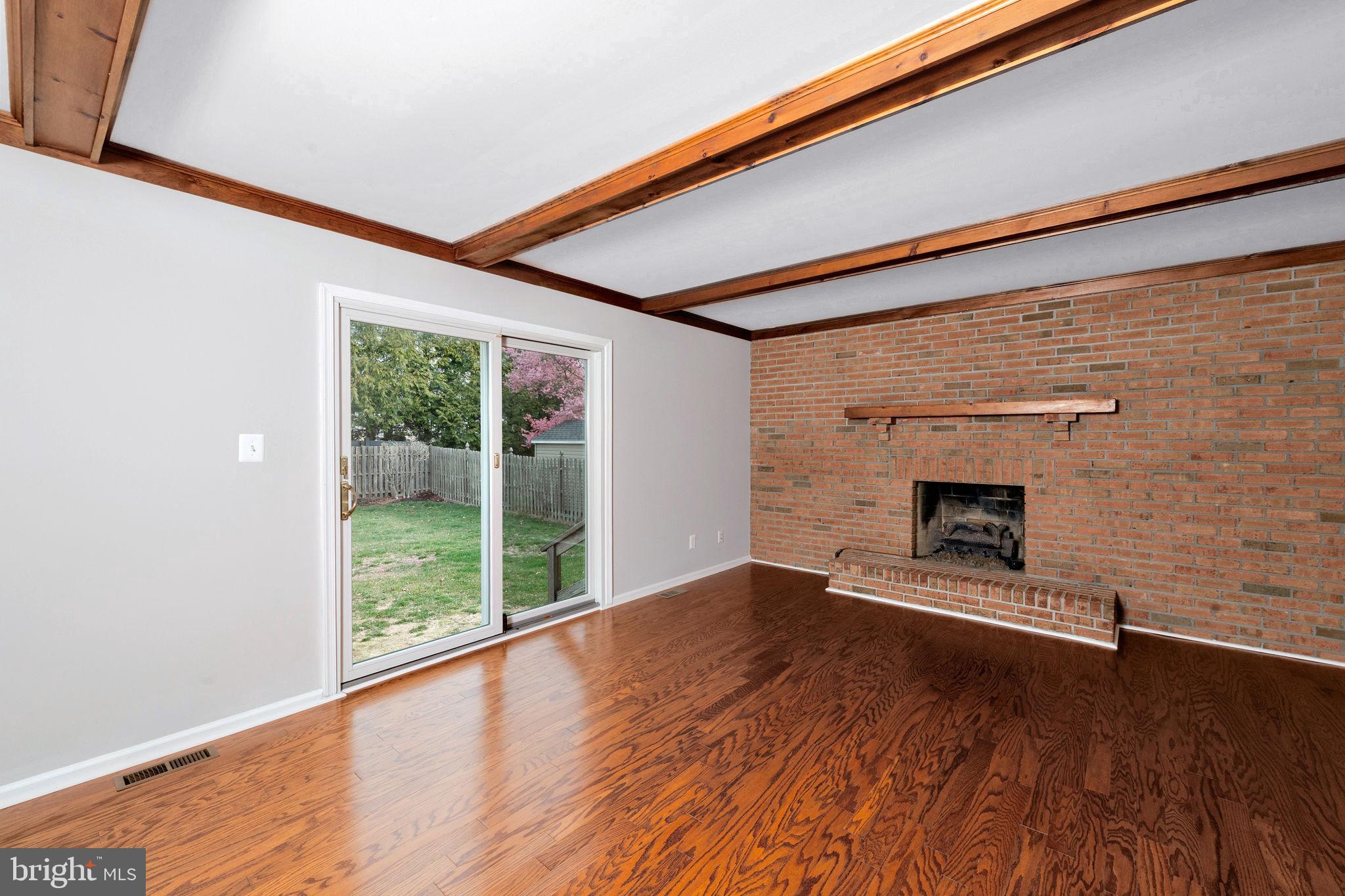 3 Patrick Henry Drive Marlton, NJ 08053 - Photo 17 of 41 a view of empty room with wooden floor and fireplace