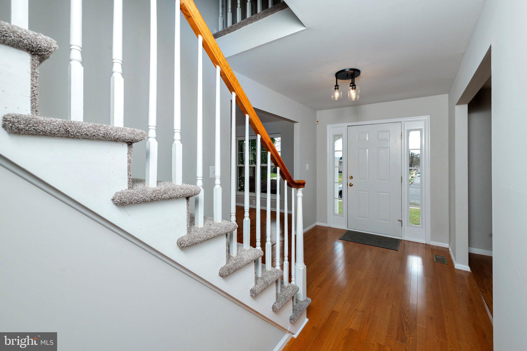 3 Patrick Henry Drive Marlton, NJ 08053 - Photo 22 of 41 a view of a hallway with wooden floor and staircase