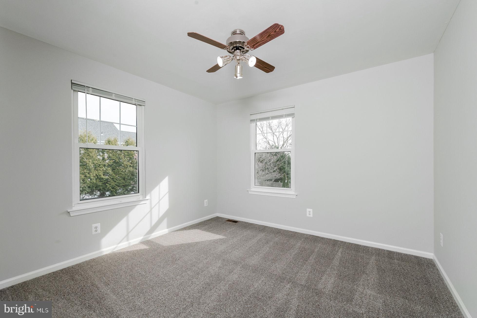 3 Patrick Henry Drive Marlton, NJ 08053 - Photo 24 of 41 an empty room with a window and a ceiling fan