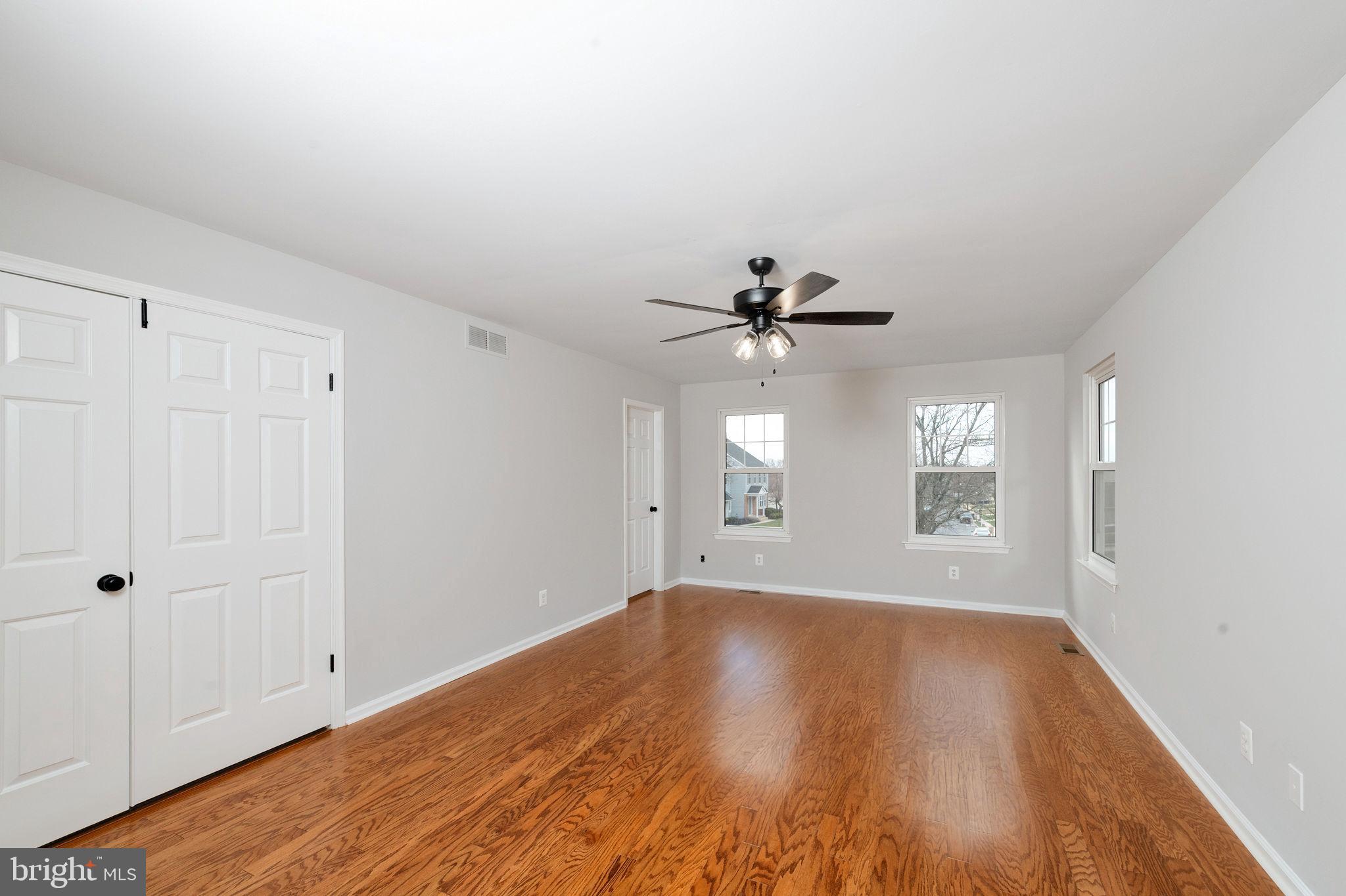 3 Patrick Henry Drive Marlton, NJ 08053 - Photo 29 of 41 a view of empty room with wooden floor and fan