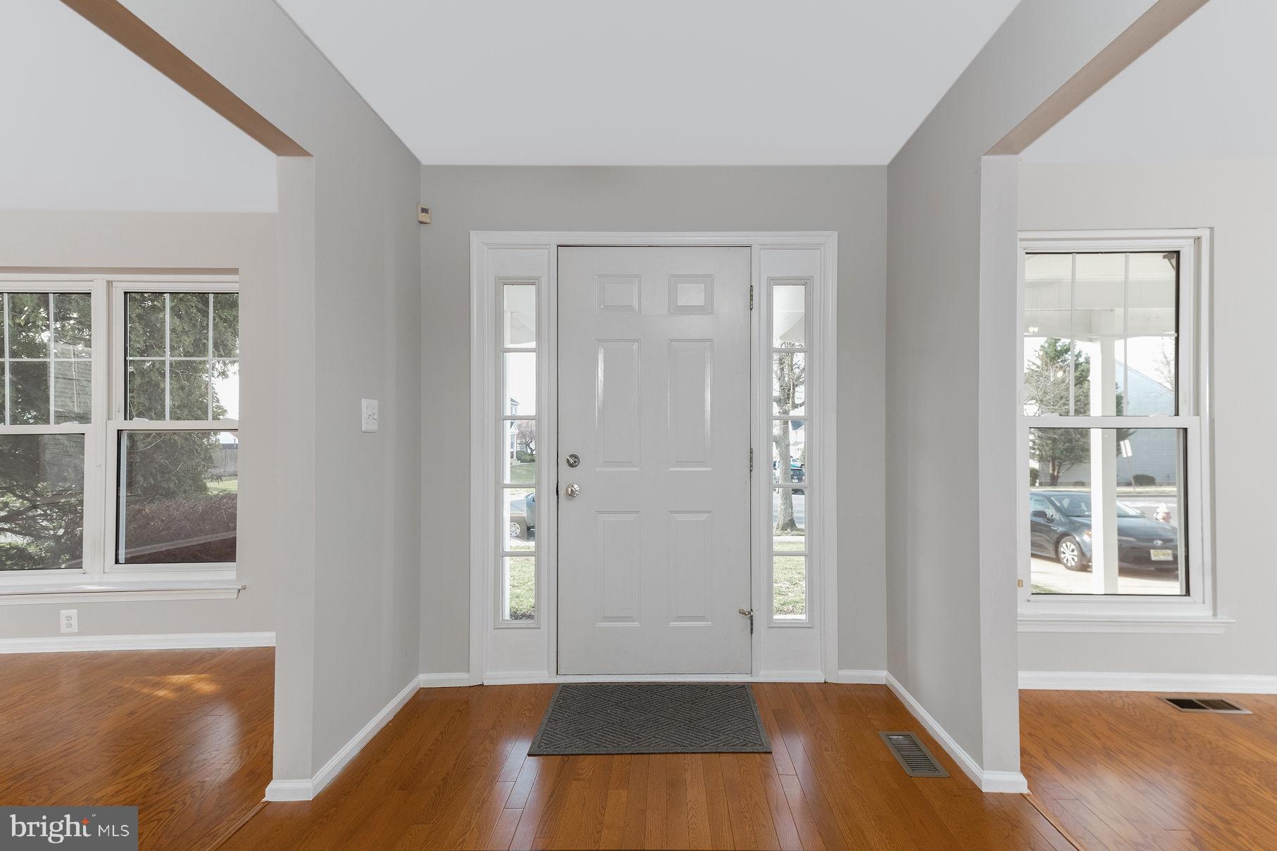 3 Patrick Henry Drive Marlton, NJ 08053 - Photo 3 of 41 a view of a livingroom with wooden floor and a bathroom