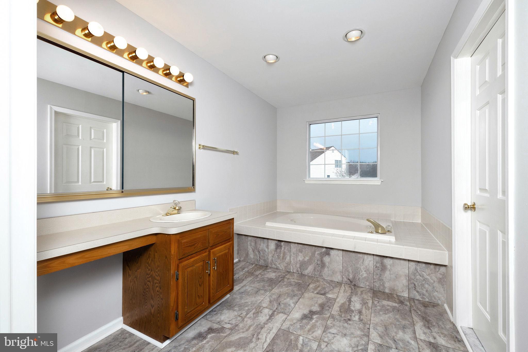 3 Patrick Henry Drive Marlton, NJ 08053 - Photo 31 of 41 a spacious bathroom with a tub double sink and mirror