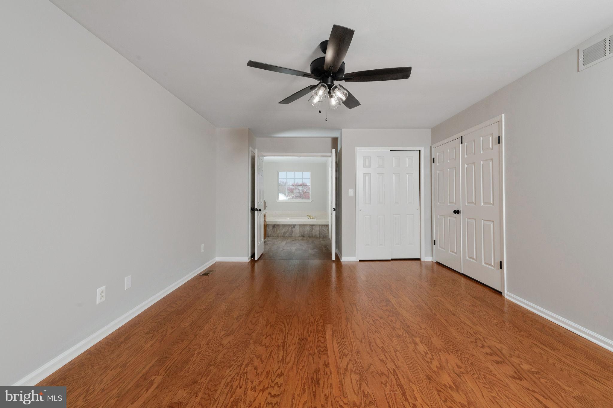 3 Patrick Henry Drive Marlton, NJ 08053 - Photo 32 of 41 a view of an empty room and wooden floor