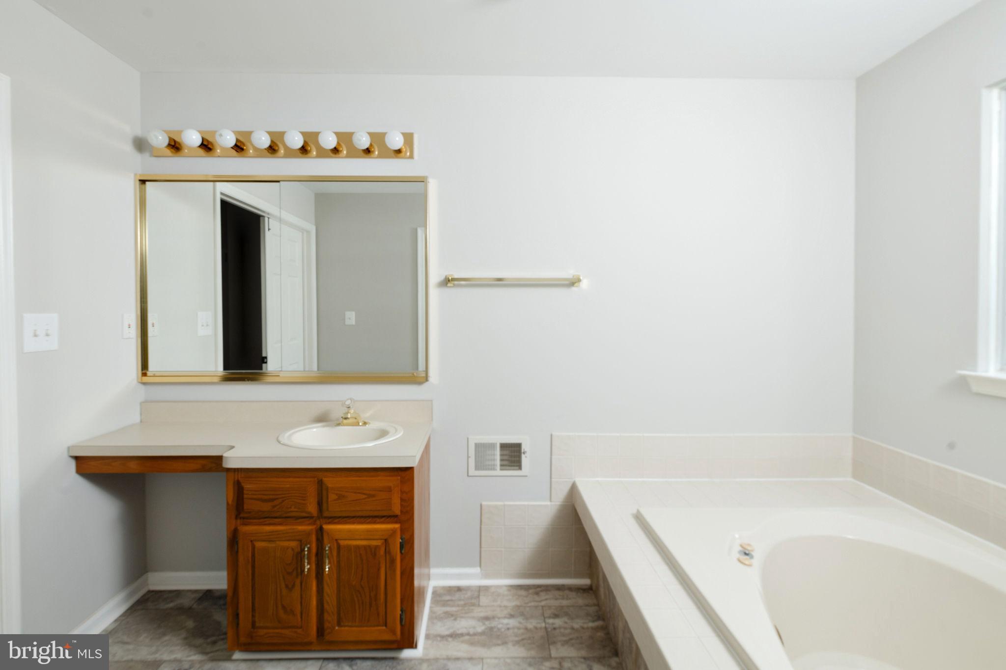 3 Patrick Henry Drive Marlton, NJ 08053 - Photo 35 of 41 a bathroom with a bathtub sink and mirror