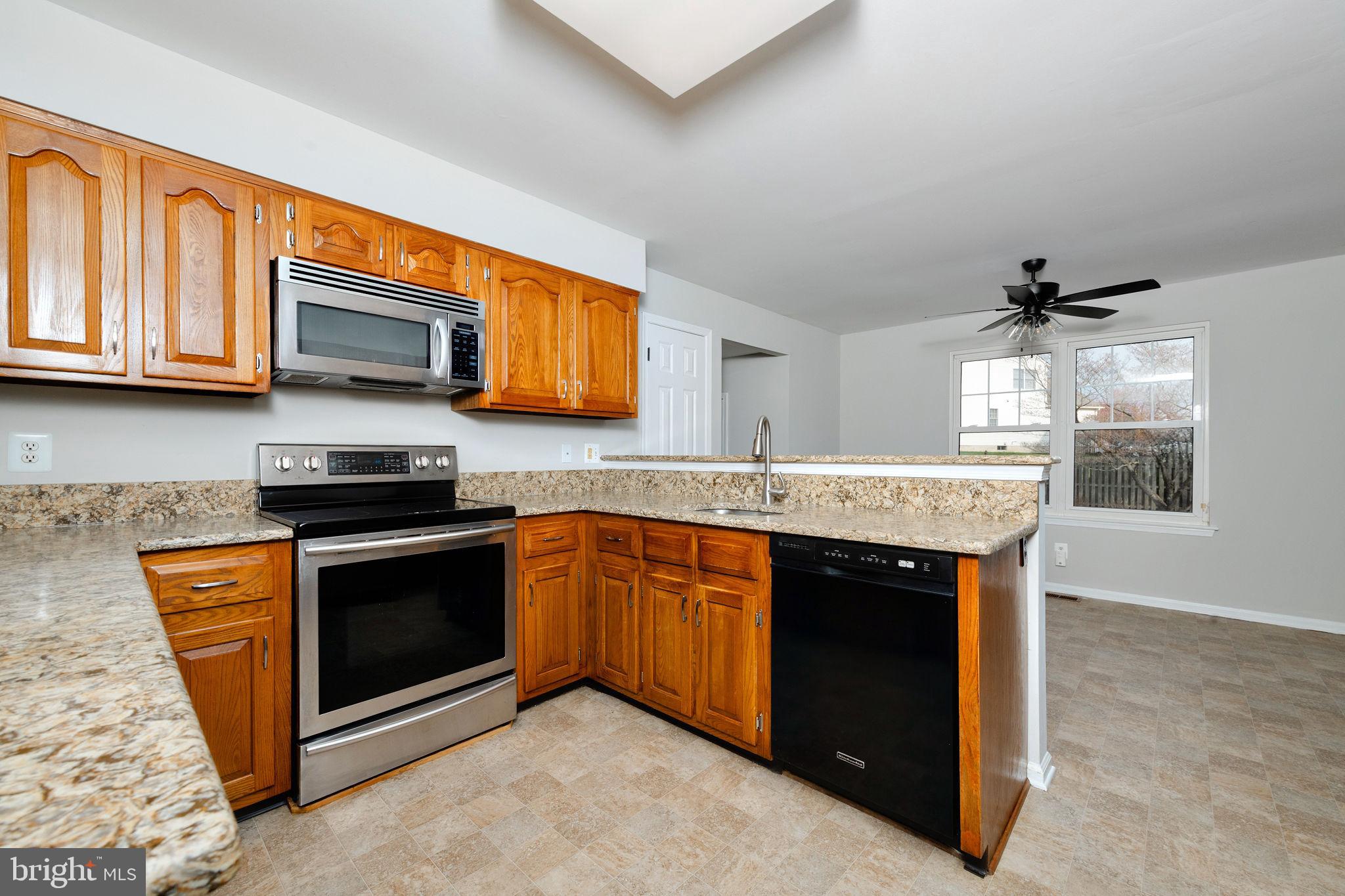 3 Patrick Henry Drive Marlton, NJ 08053 - Photo 7 of 41 a kitchen with stainless steel appliances granite countertop a stove a sink and a microwave
